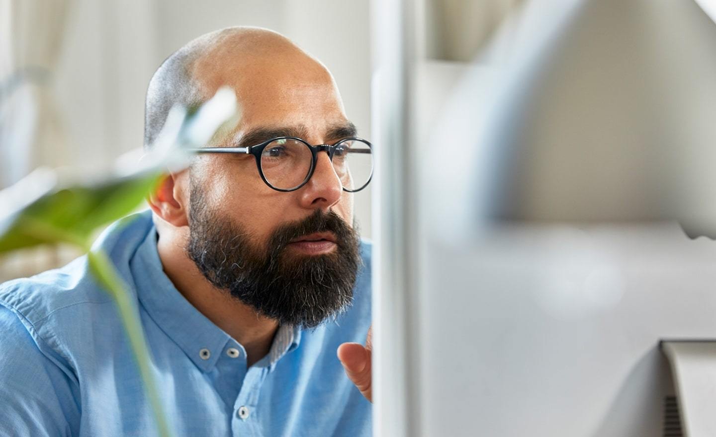 Focused man working on computer