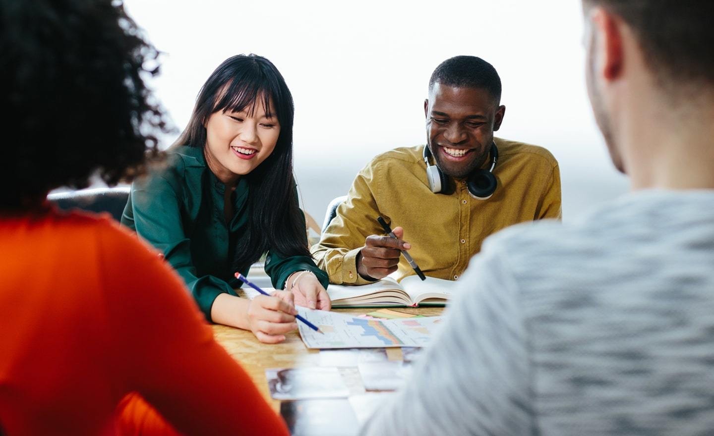 Group of coworkers in learning workshop meeting