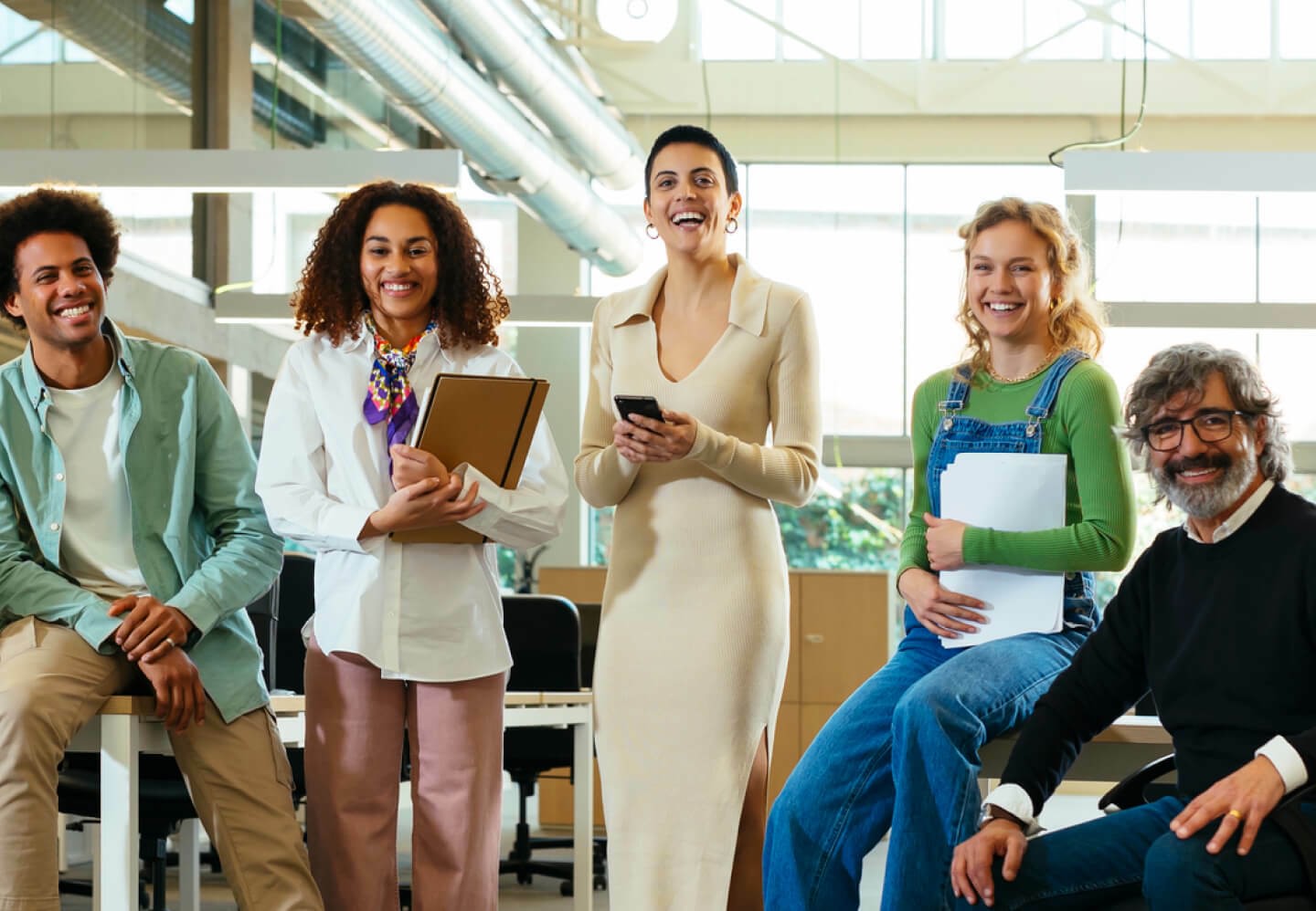 Image of coworkers smiling in office