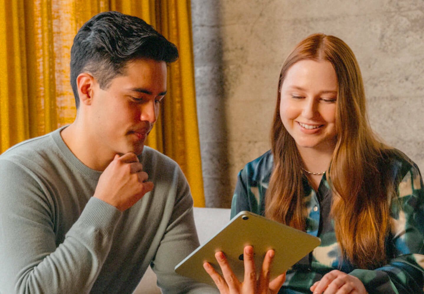 Photo of coworkers talking with tablet in office 2