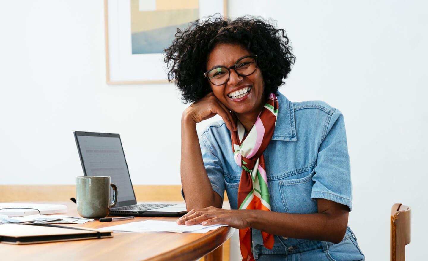 Portrait of a happy employee working at home