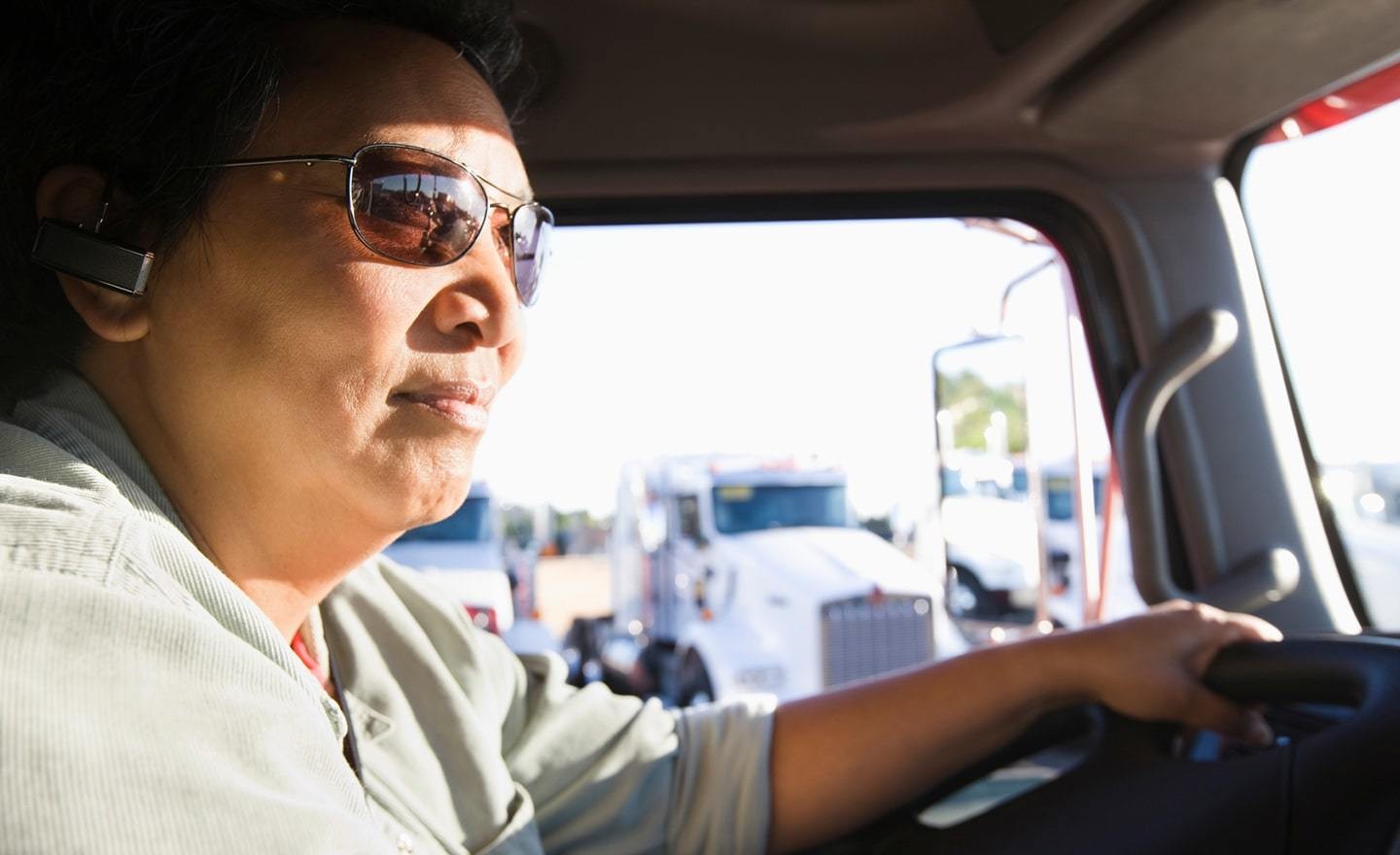 Truck driver seen in cab of truck