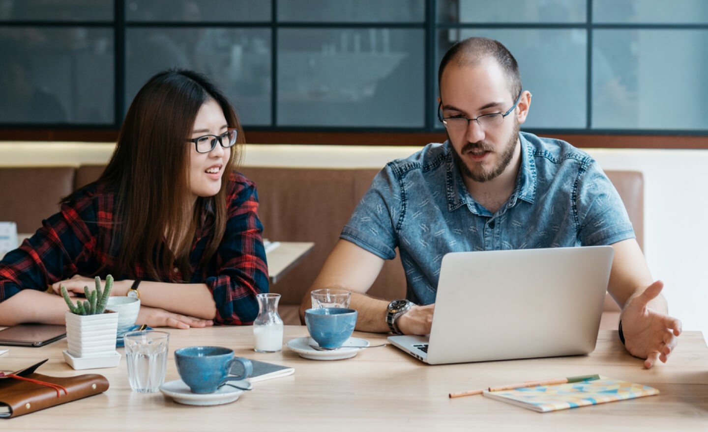 Two people working in a coffee shop