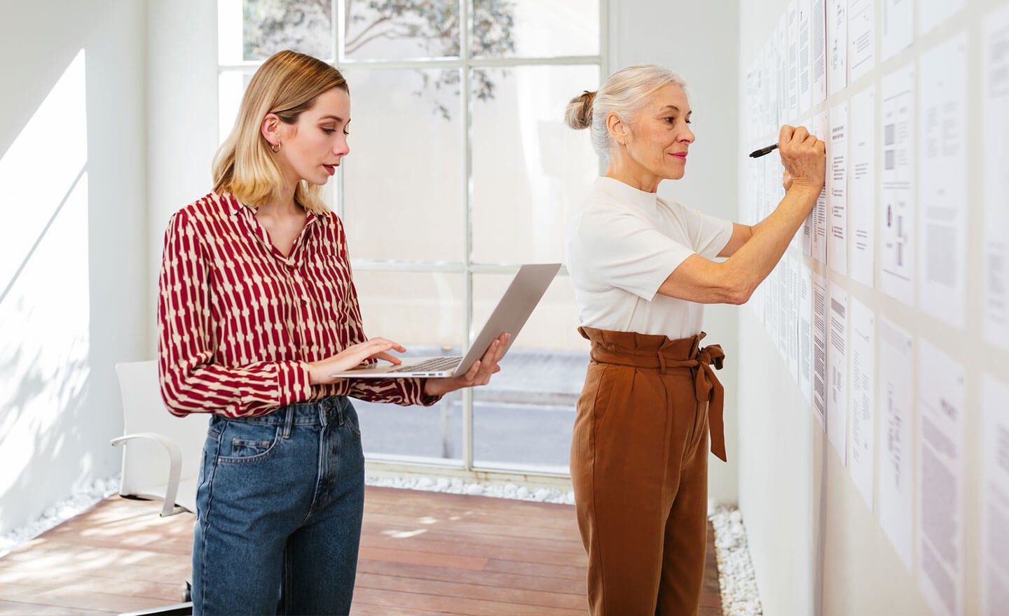 Two women working together in office