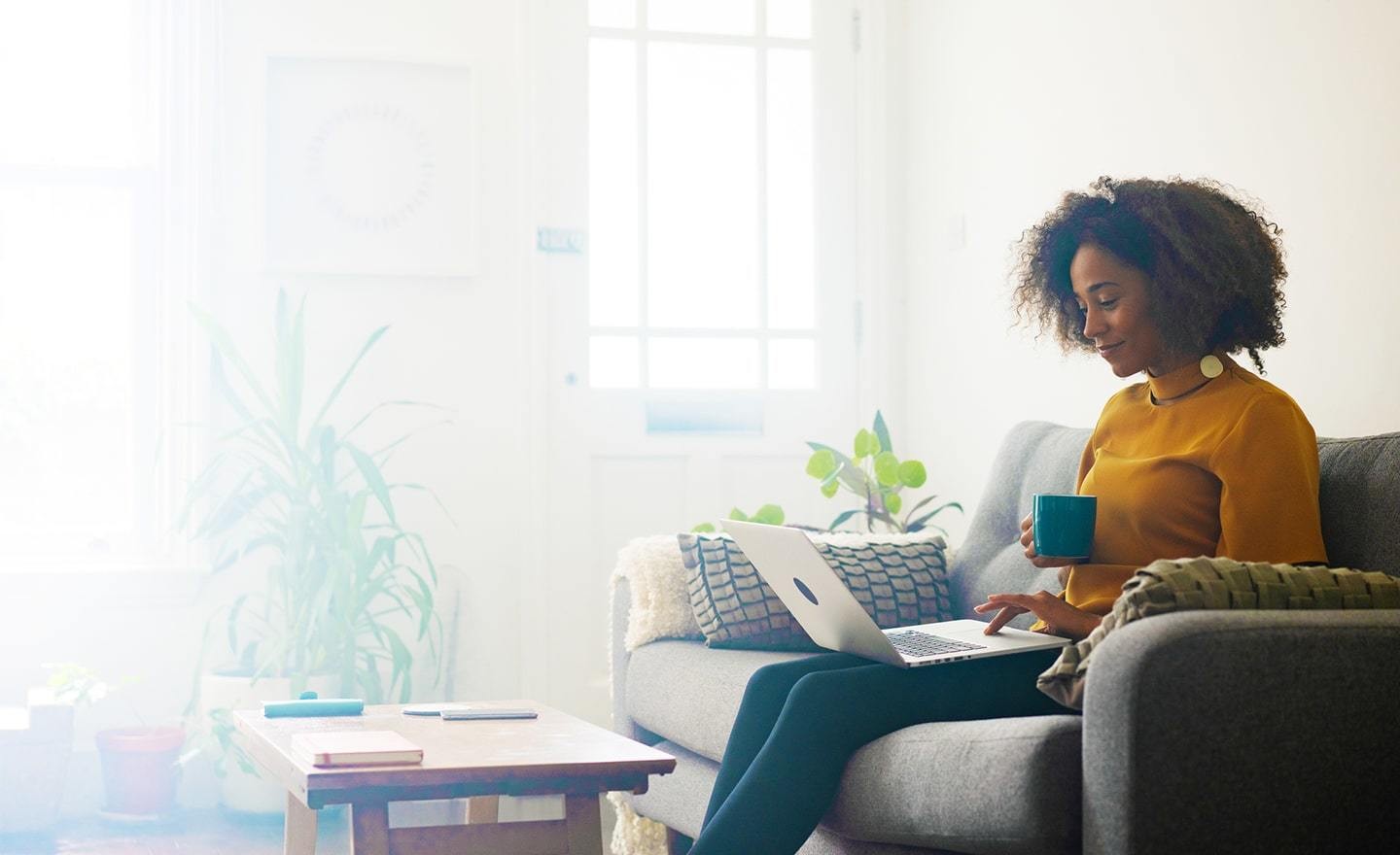 Woman at home working on laptop