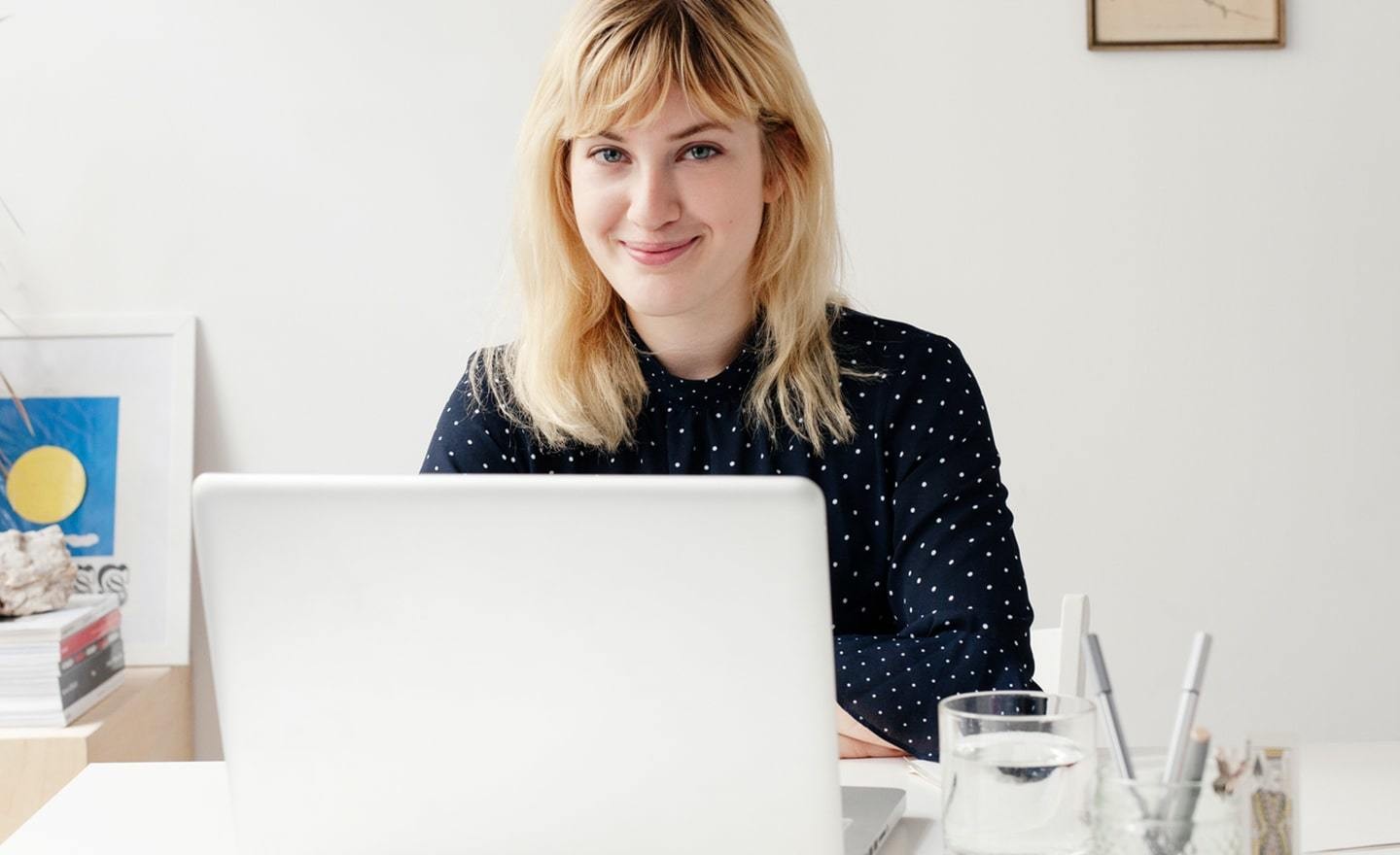 Woman smiling at laptop