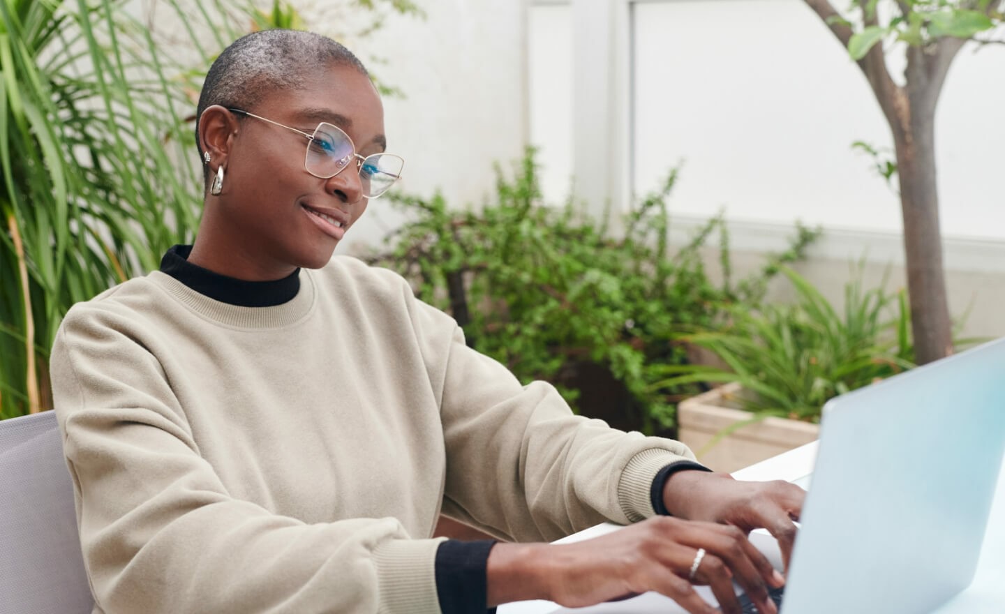 Woman typing on laptop