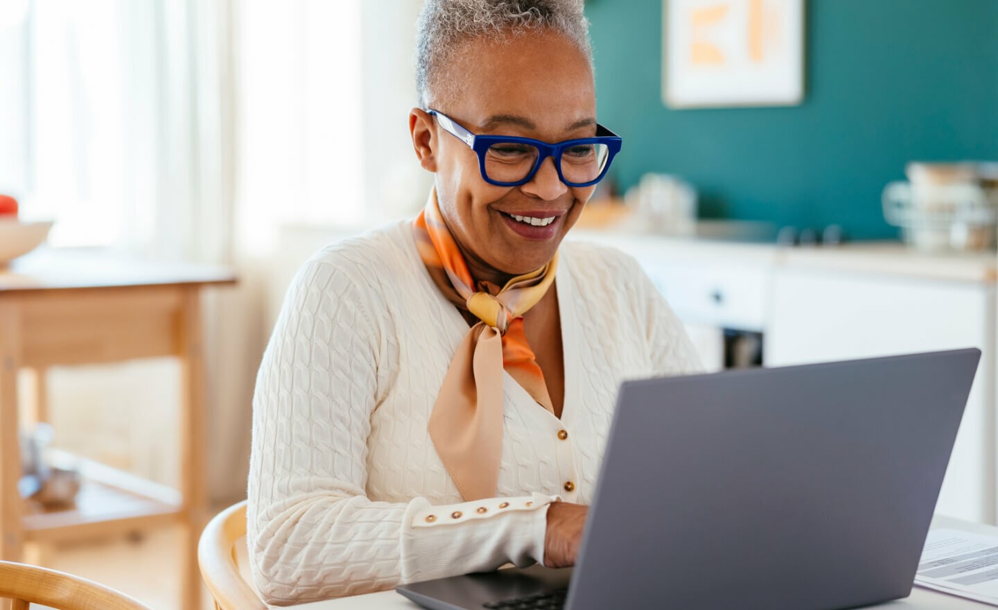 Woman working on laptop at home 1