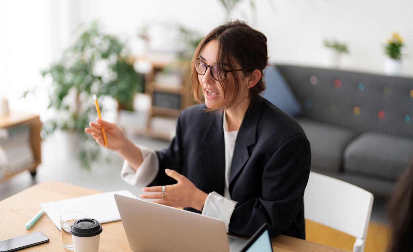 Young woman leading business meeting