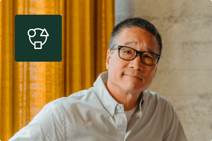 Asian man posing in an office setting DEI icon