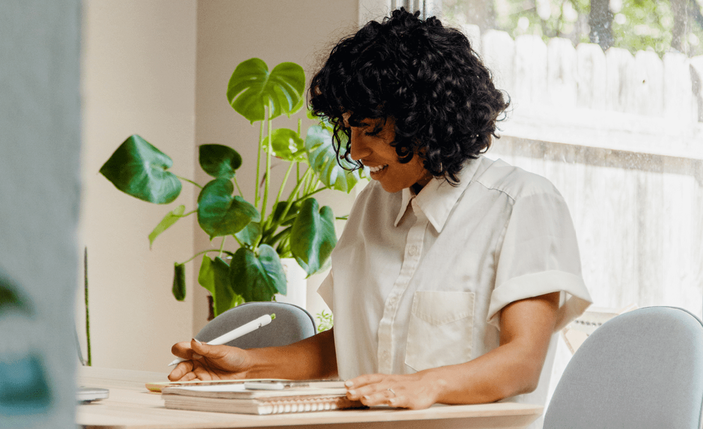 Recruiter taking notes after candidate phone interview