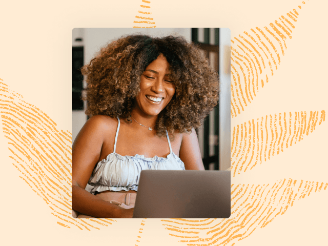 Woman smiling while typing on a laptop resource 5